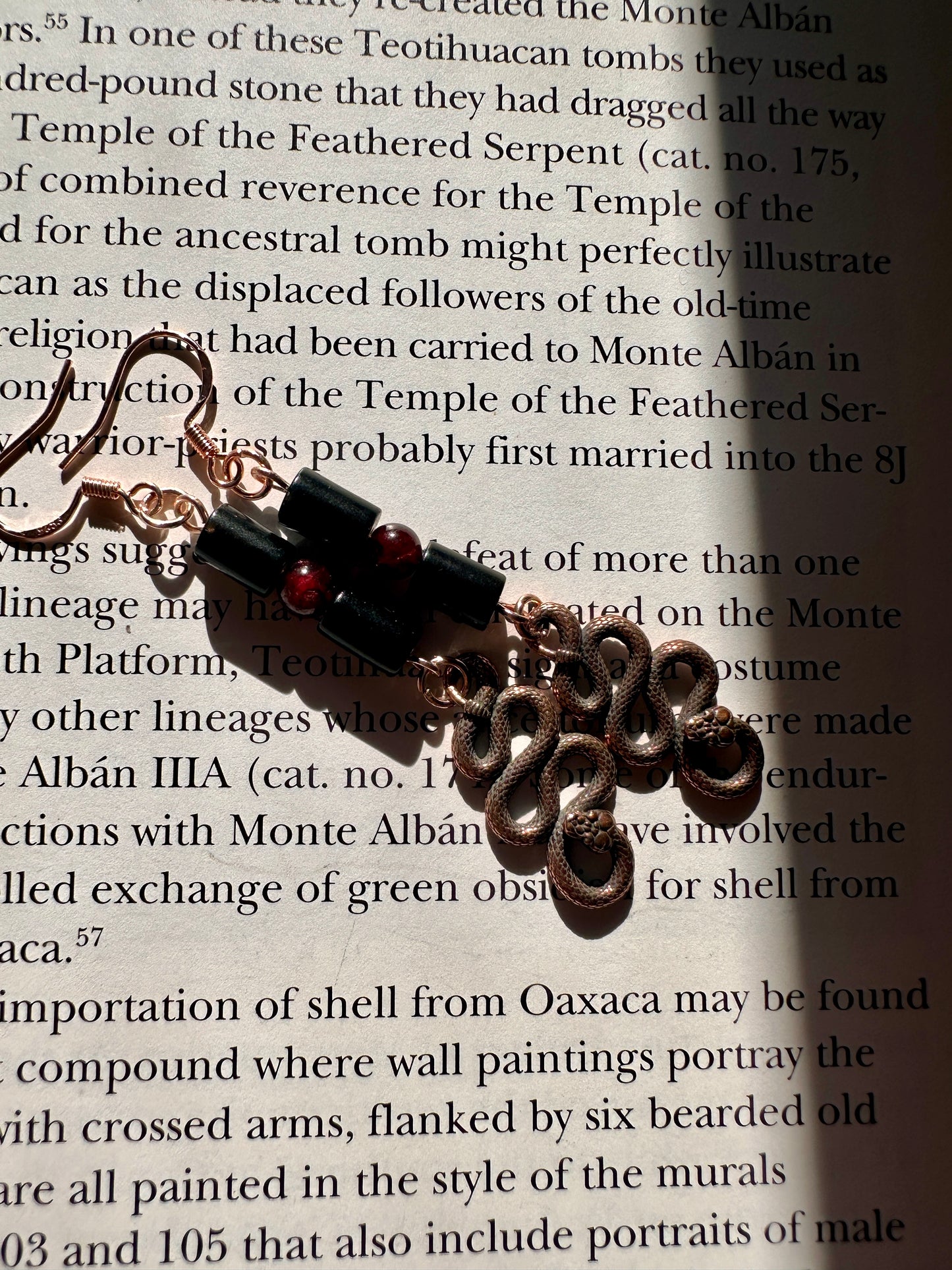 Obsidian and garnet serpent earrings