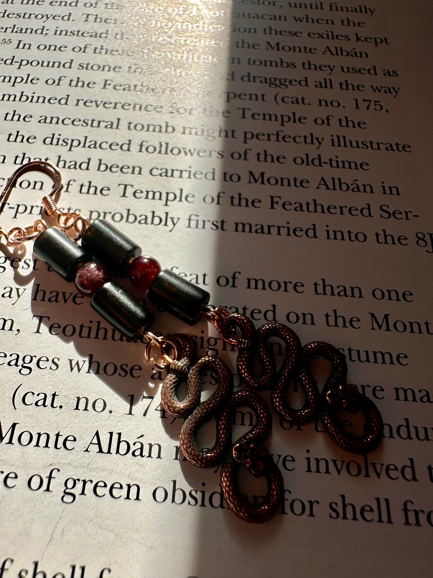 Obsidian and garnet serpent earrings