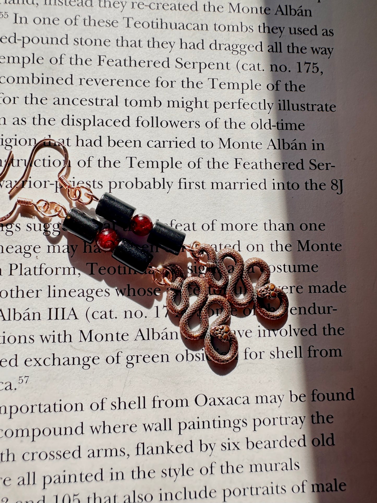 Obsidian and garnet serpent earrings